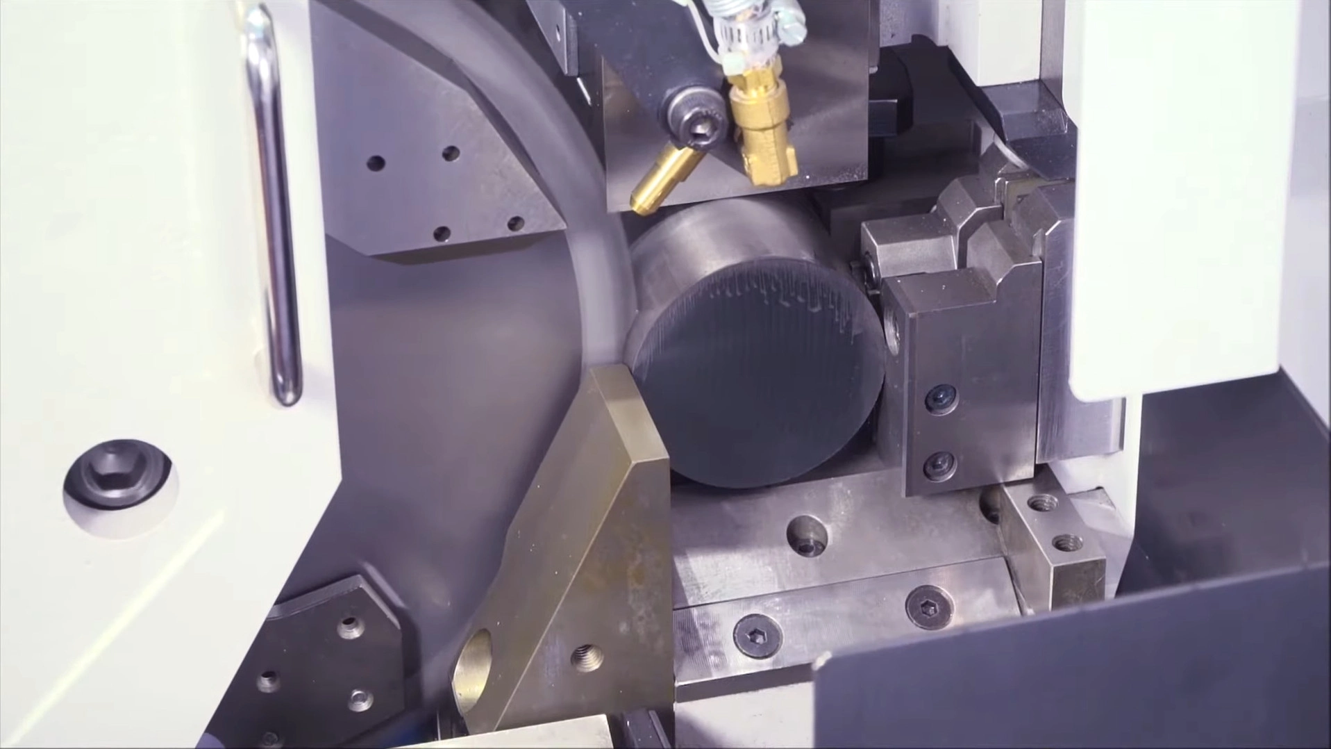 High-speed circular cold saw cutting steel bar to length